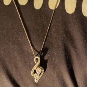 Diamond music note necklace.